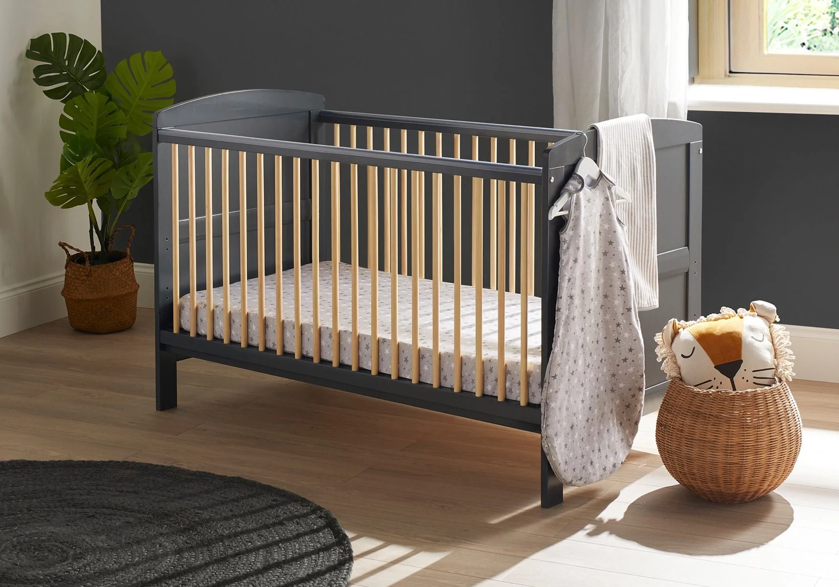 grey cot in nursery