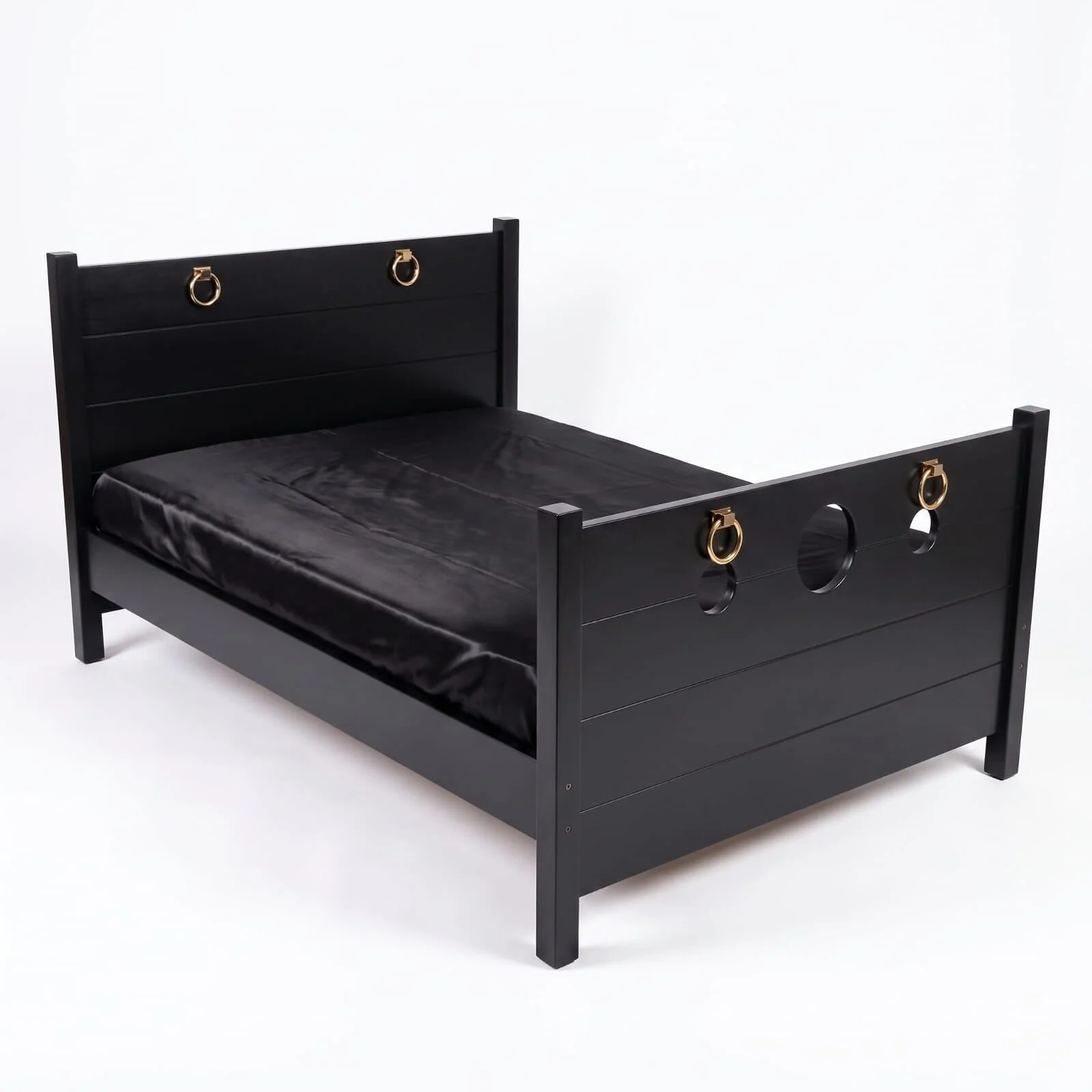 The Sovereign Bed in Onyx Black, studio side view showing the footboard rings and cut-outs